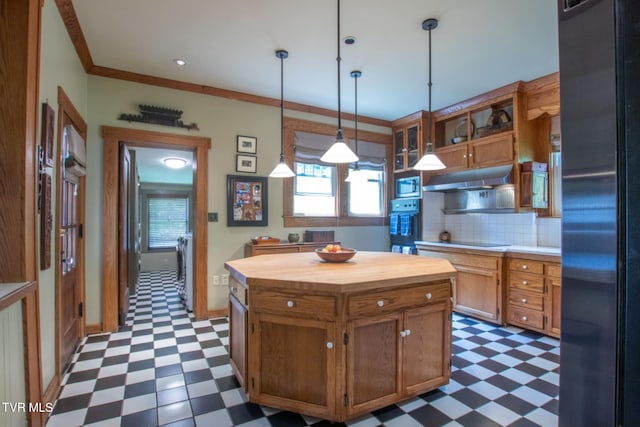 940 Park St, Bristol, VA 24201 - kitchen with dark flooring, black appliances, wood counters, under cabinet range hood, and ornamental molding