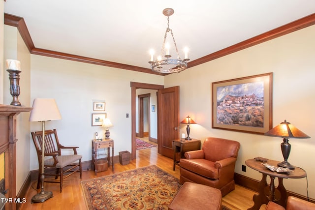 940 Park St, Bristol, VA 24201 - living area featuring ornamental molding, a chandelier, and light wood-style flooring