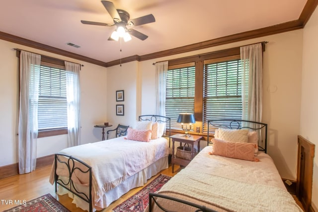 940 Park St, Bristol, VA 24201 - bedroom featuring ornamental molding, wood finished floors, and ceiling fan