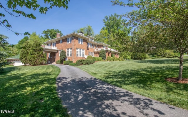 940 Park St, Bristol, VA 24201 - view of front of home with a front lawn, brick siding, and a chimney
