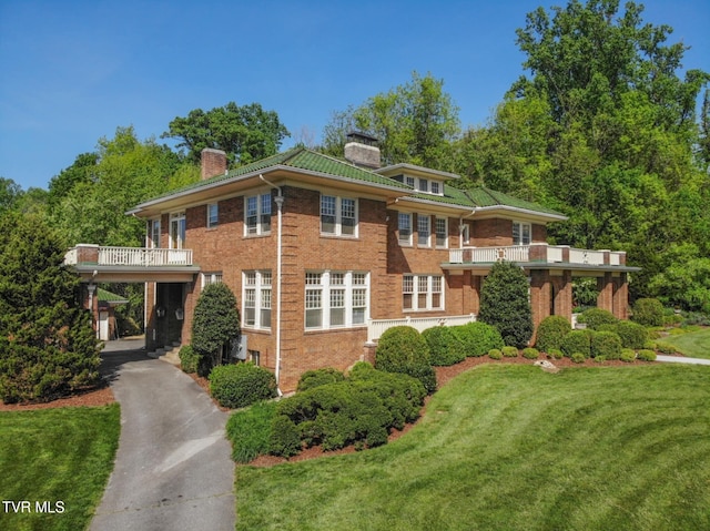 940 Park St, Bristol, VA 24201 - view of front facade with a chimney, brick siding, and a front yard