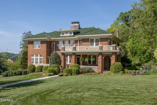 940 Park St, Bristol, VA 24201 - view of front of home with a chimney, covered porch, a balcony, and brick siding