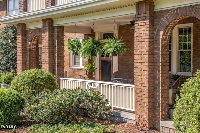 940 Park St, Bristol, VA 24201 - doorway to property featuring brick siding and covered porch
