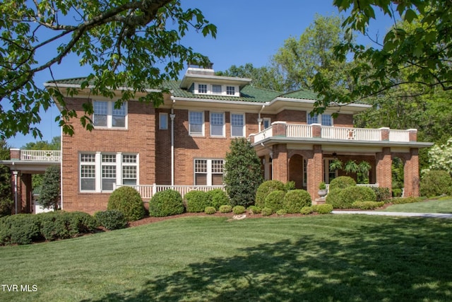 940 Park St, Bristol, VA 24201 - view of front of property featuring brick siding, a front yard, and a balcony