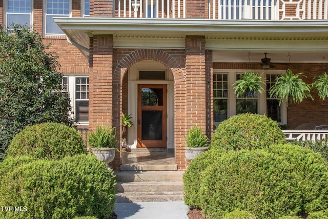 940 Park St, Bristol, VA 24201 - doorway to property with brick siding and a ceiling fan