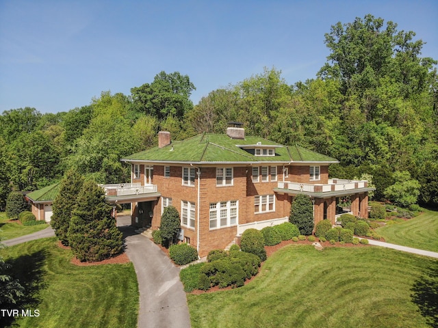 940 Park St, Bristol, VA 24201 - view of front facade with a chimney, a front lawn, asphalt driveway, and a balcony