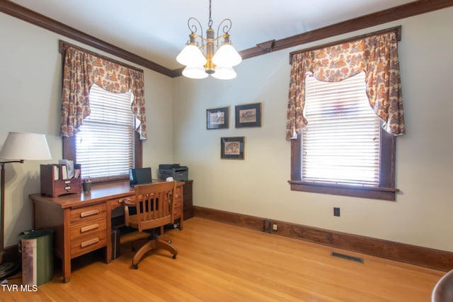940 Park St, Bristol, VA 24201 - office featuring a chandelier, ornamental molding, light wood finished floors, and healthy amount of natural light