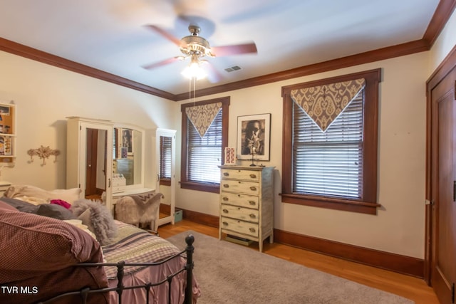 940 Park St, Bristol, VA 24201 - bedroom with ornamental molding, wood finished floors, and ceiling fan