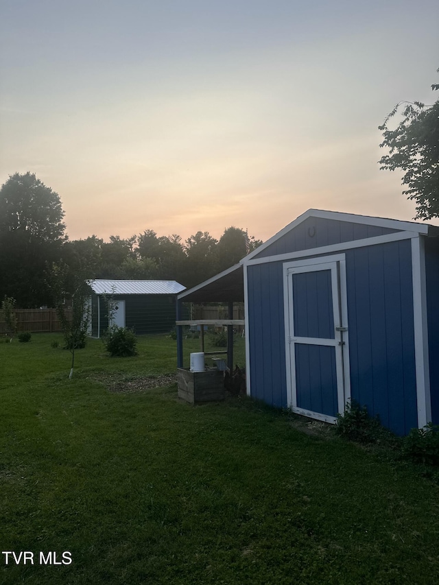 461 S Shady Ave, Damascus, VA 24236 - outdoor structure at dusk with a yard and a storage unit