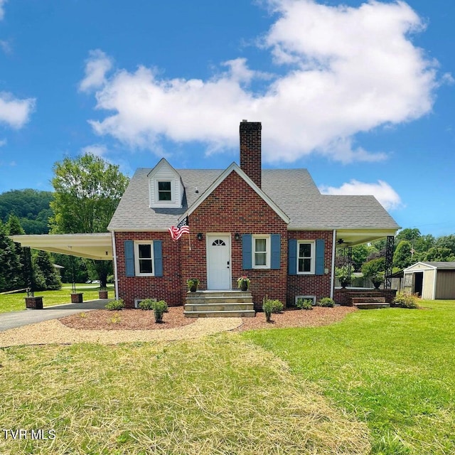 461 S Shady Ave, Damascus, VA 24236 - view of front of property featuring brick siding, a front yard, a chimney, an attached carport, and driveway