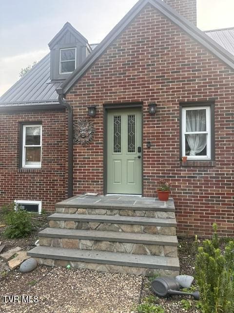 461 S Shady Ave, Damascus, VA 24236 - entrance to property with brick siding, a chimney, and a metal roof