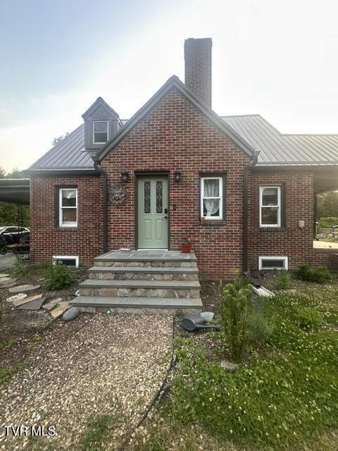 461 S Shady Ave, Damascus, VA 24236 - back of house featuring brick siding, a chimney, a metal roof, and a standing seam roof