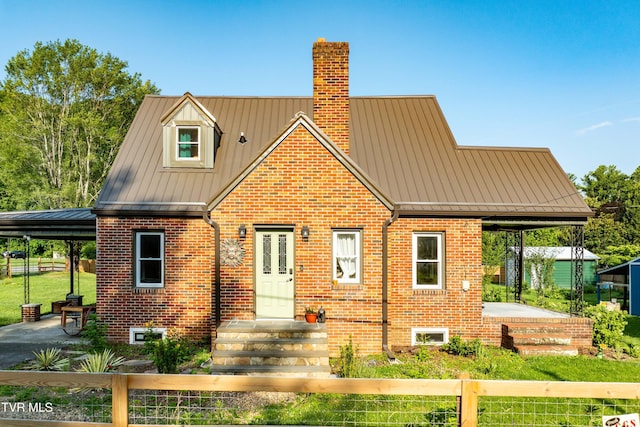 461 S Shady Ave, Damascus, VA 24236 - view of front of property with brick siding, a chimney, a standing seam roof, and a metal roof