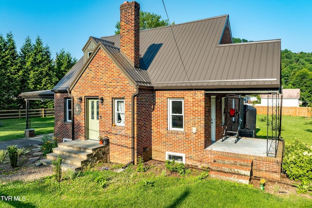 461 S Shady Ave, Damascus, VA 24236 - rear view of house with brick siding, a chimney, and a standing seam roof