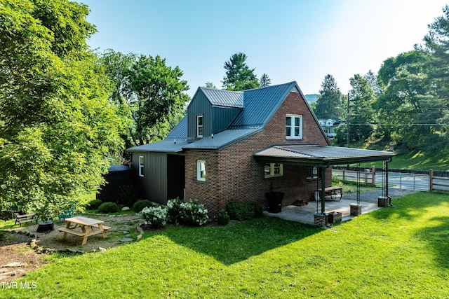 461 S Shady Ave, Damascus, VA 24236 - rear view of house featuring a patio area, a metal roof, and brick siding