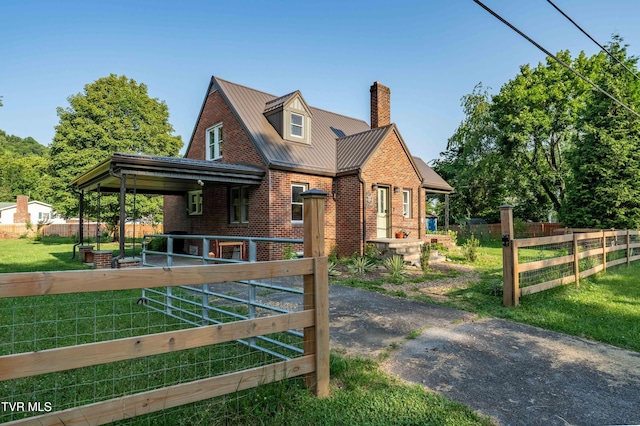 461 S Shady Ave, Damascus, VA 24236 - view of front of home featuring brick siding, a chimney, and a metal roof