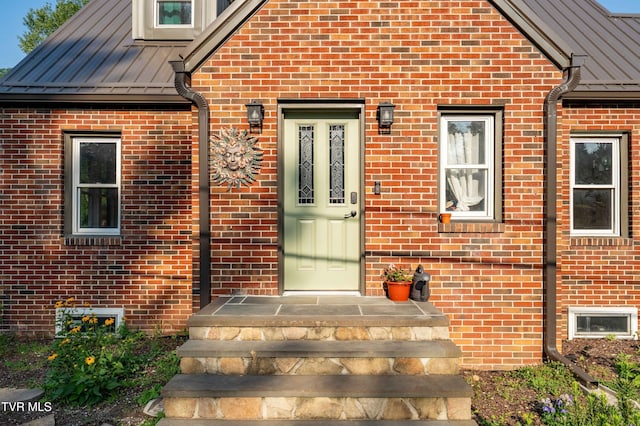 461 S Shady Ave, Damascus, VA 24236 - view of exterior entry featuring a standing seam roof, brick siding, and a metal roof