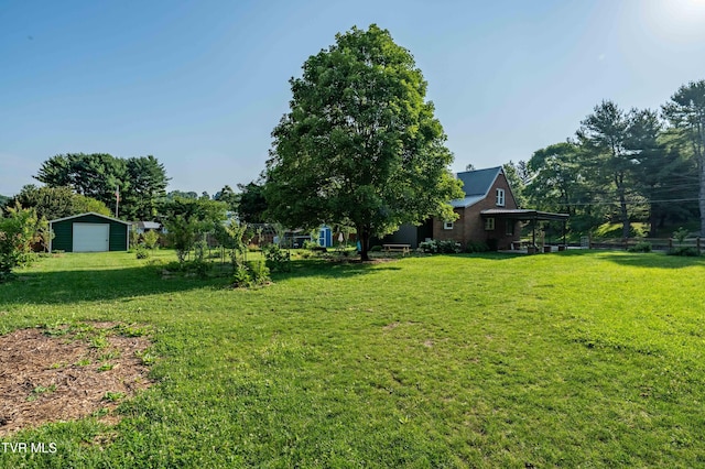 461 S Shady Ave, Damascus, VA 24236 - view of green lawn featuring a detached garage and an outdoor structure