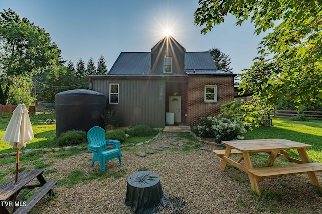 461 S Shady Ave, Damascus, VA 24236 - back of house with brick siding and a metal roof
