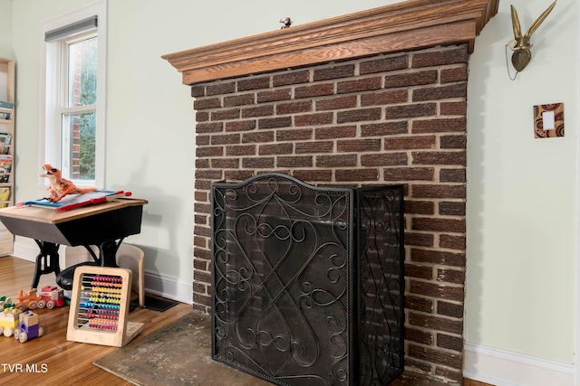 461 S Shady Ave, Damascus, VA 24236 - detailed view of wood finished floors and a brick fireplace