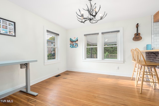 461 S Shady Ave, Damascus, VA 24236 - unfurnished dining area with a chandelier and light wood-style floors