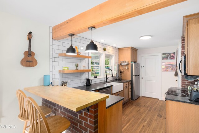 461 S Shady Ave, Damascus, VA 24236 - kitchen with appliances with stainless steel finishes, a peninsula, decorative backsplash, dark countertops, and recessed lighting
