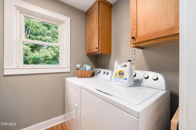 461 S Shady Ave, Damascus, VA 24236 - washroom with cabinet space, washer and clothes dryer, and wood finished floors