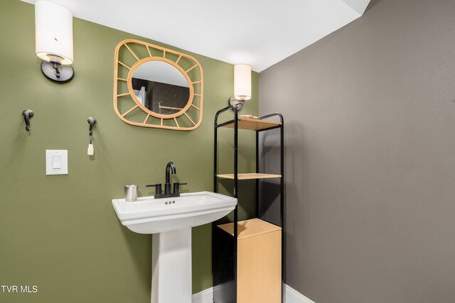 461 S Shady Ave, Damascus, VA 24236 - bathroom featuring baseboards and a sink
