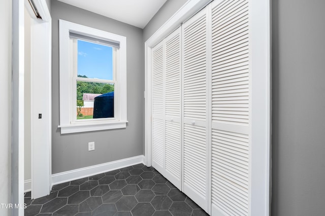 461 S Shady Ave, Damascus, VA 24236 - hallway with baseboards and dark tile patterned flooring