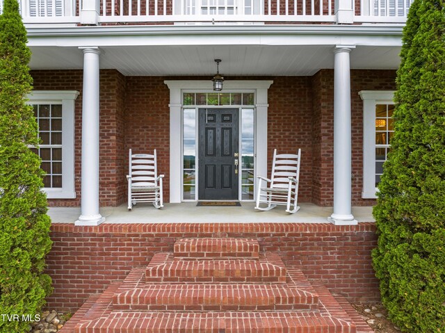512 Shea Ct, Morristown, TN 37814 - property entrance featuring a balcony, a porch, and brick siding