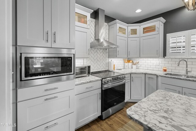 512 Shea Ct, Morristown, TN 37814 - kitchen with stainless steel appliances, wall chimney exhaust hood, backsplash, recessed lighting, and glass insert cabinets