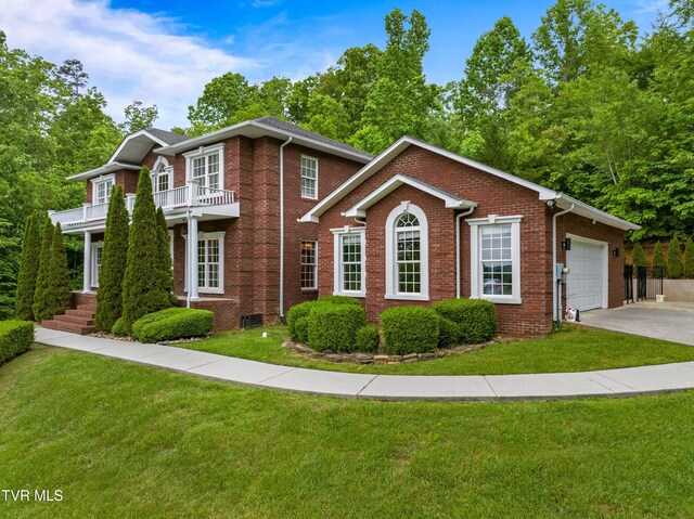 512 Shea Ct, Morristown, TN 37814 - colonial inspired home featuring brick siding, a balcony, a front lawn, and driveway