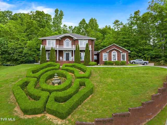 512 Shea Ct, Morristown, TN 37814 - colonial inspired home featuring a balcony, a front yard, and brick siding