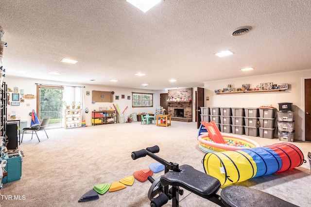 274 Hickam Orchard Rd, Kingsport, TN 37660 - playroom with a textured ceiling, carpet floors, a brick fireplace, and recessed lighting