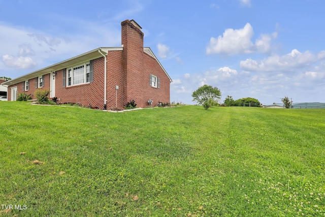 908 Middle Ave, Marion, VA 24354 - view of property exterior with a lawn, brick siding, and a chimney