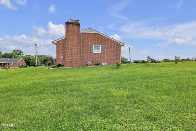 908 Middle Ave, Marion, VA 24354 - view of property exterior featuring a chimney, a yard, and brick siding