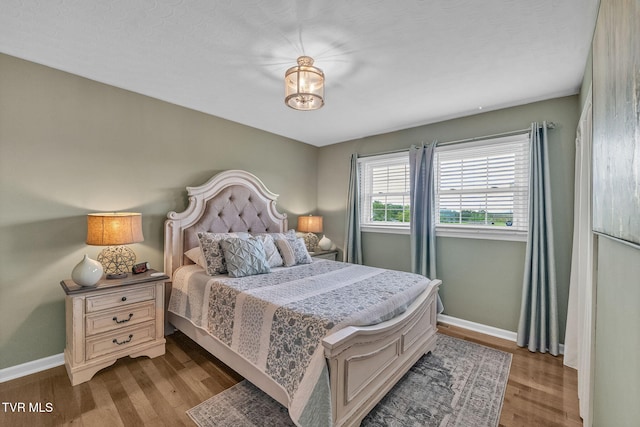 908 Middle Ave, Marion, VA 24354 - bedroom with baseboards and dark wood finished floors