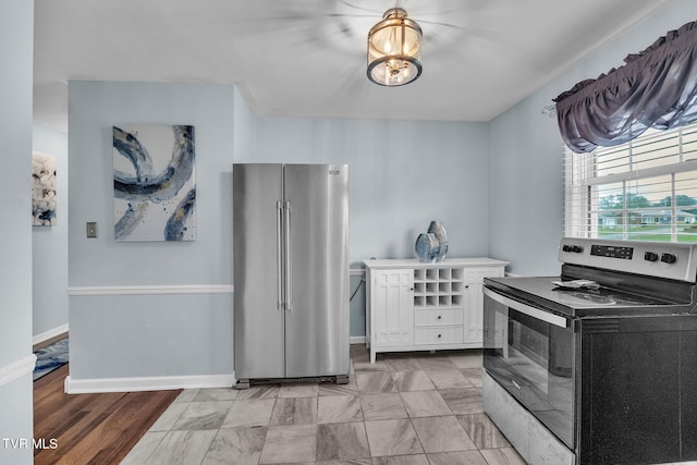 908 Middle Ave, Marion, VA 24354 - kitchen with stainless steel appliances and white cabinets