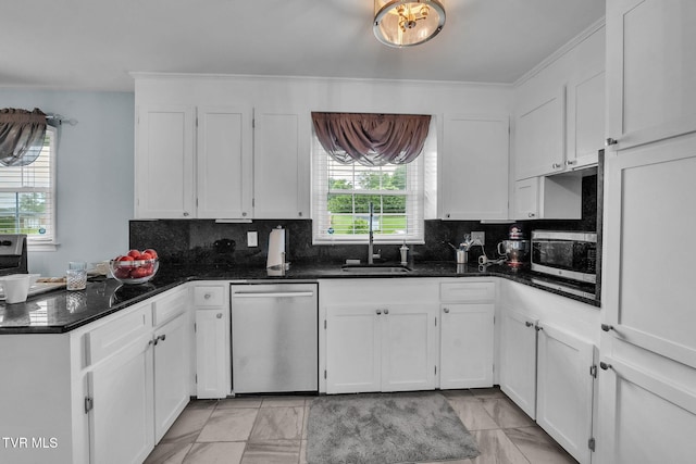 908 Middle Ave, Marion, VA 24354 - kitchen featuring appliances with stainless steel finishes, white cabinets, a peninsula, decorative backsplash, and ornamental molding