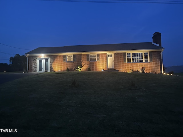 908 Middle Ave, Marion, VA 24354 - ranch-style house featuring a chimney, brick siding, and french doors