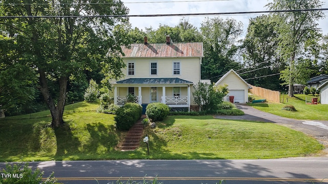 1330 Carroll Creek Rd, Gray, TN 37615 - view of front of house with a porch, a front lawn, a garage, and an outdoor structure