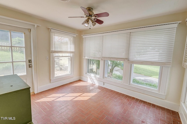 1330 Carroll Creek Rd, Gray, TN 37615 - unfurnished sunroom featuring brick floors and baseboards