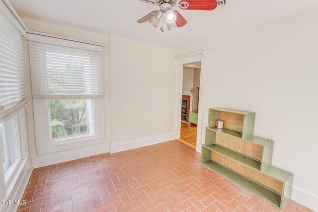 1330 Carroll Creek Rd, Gray, TN 37615 - unfurnished room with brick patterned floors, ceiling fan, and healthy amount of natural light