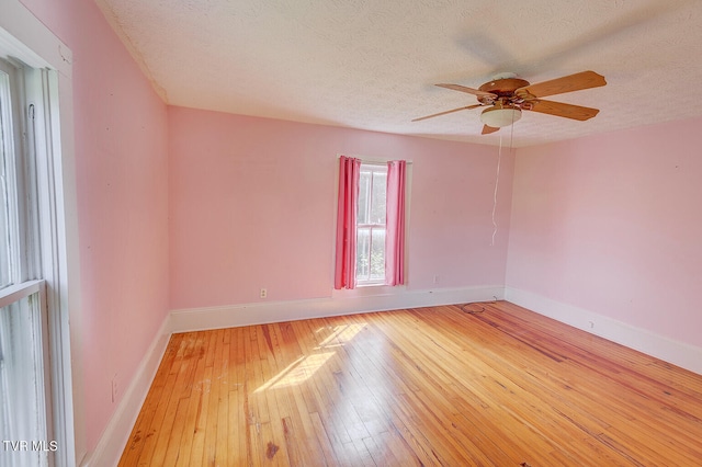 1330 Carroll Creek Rd, Gray, TN 37615 - spare room featuring a textured ceiling, wood-type flooring, and a ceiling fan