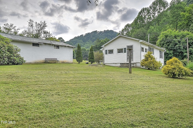 325 Cove Creek Rd, Roan Mountain, TN 37687 - view of grassy yard with a mountain view and entry steps