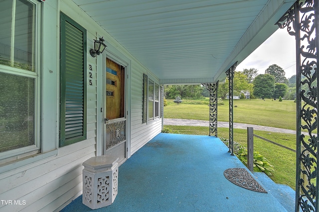 325 Cove Creek Rd, Roan Mountain, TN 37687 - covered porch with a lawn