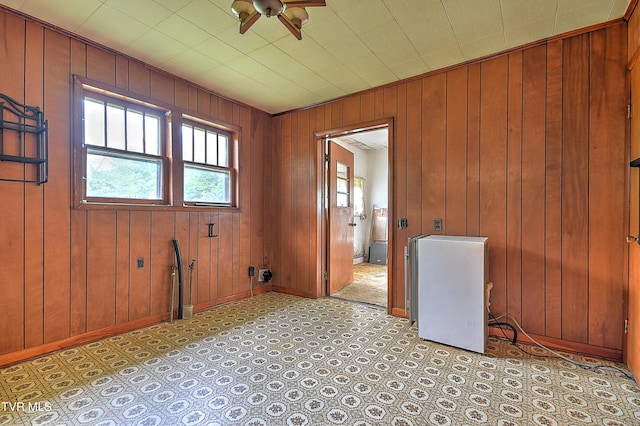 325 Cove Creek Rd, Roan Mountain, TN 37687 - unfurnished room featuring ceiling fan and wooden walls