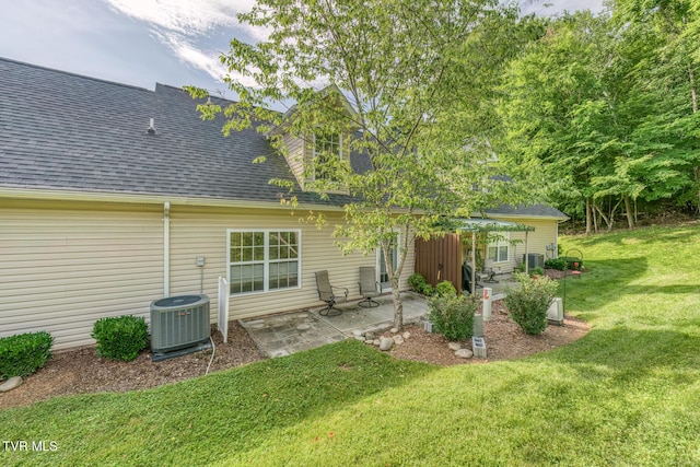 603 Stratford Ct Unit 603, Gray, TN 37615 - rear view of property featuring roof with shingles, a patio area, and a yard