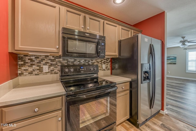 603 Stratford Ct Unit 603, Gray, TN 37615 - kitchen featuring black appliances, light countertops, light wood-style flooring, ceiling fan, and decorative backsplash