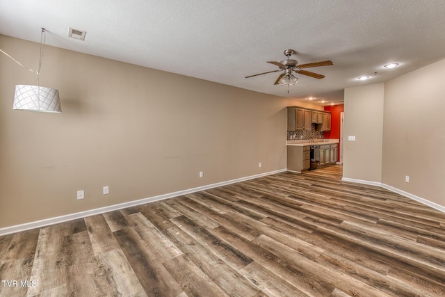 603 Stratford Ct Unit 603, Gray, TN 37615 - unfurnished living room featuring dark wood-type flooring, ceiling fan, recessed lighting, and a textured ceiling